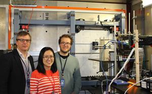 Two men and a woman inside the ChipIr beamline