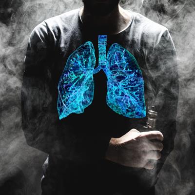 A man vaping, with his lungs highlighted in blue