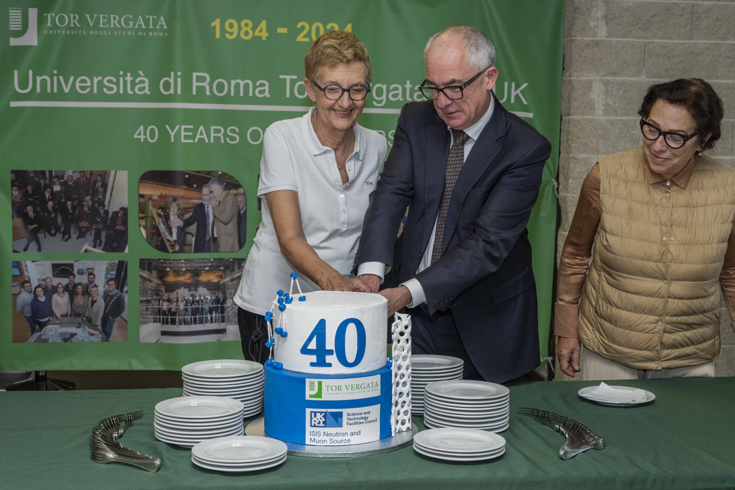 Picture of the cutting of the celebration cake